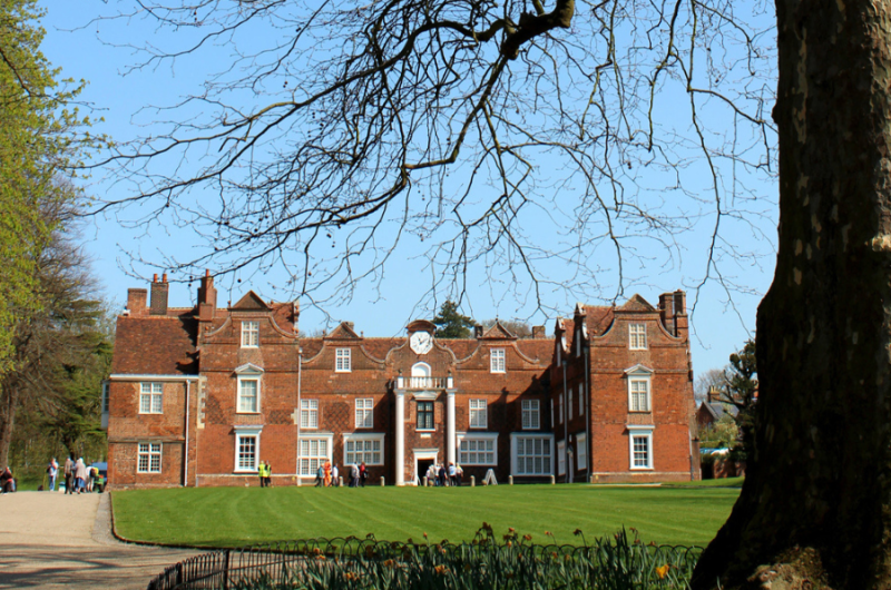 A large Elizabethan mansion in red brick, set in a park